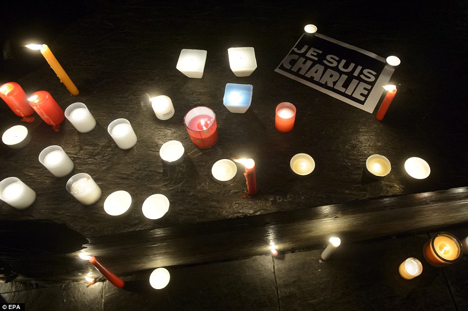 247c7dac00000578-2900835-geneva_candles_and_a_je_suis_charlie_mark_another_peaceful_prote-a-12_1420669628125